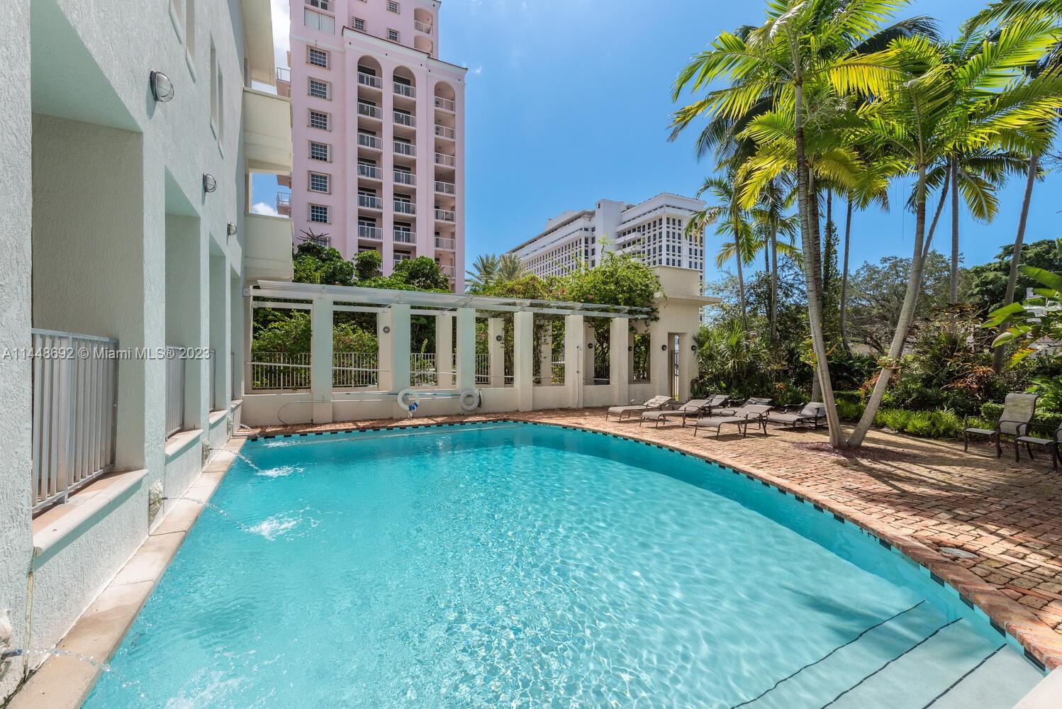 2401 Anderson Road, Unit 3 Coral Gables, FL 33134 - Photo 33 of 46 a view of a house with swimming pool and sitting area