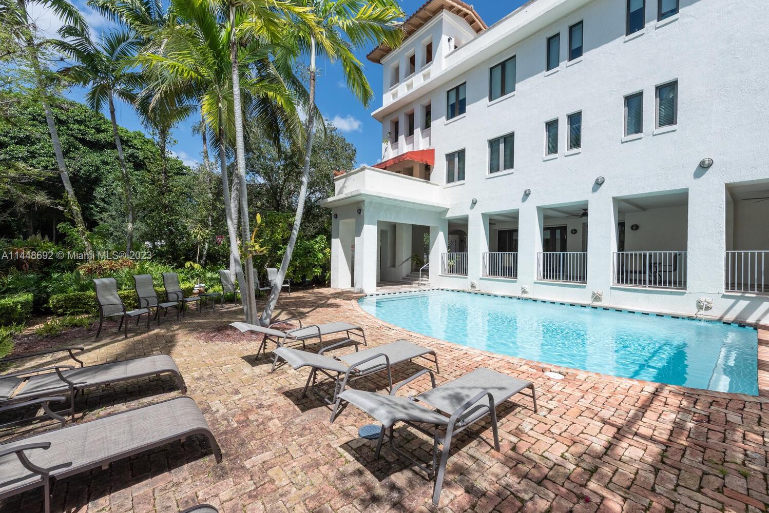 2401 Anderson Road, Unit 3 Coral Gables, FL 33134 - Photo 34 of 46 a view of a house with swimming pool and sitting area
