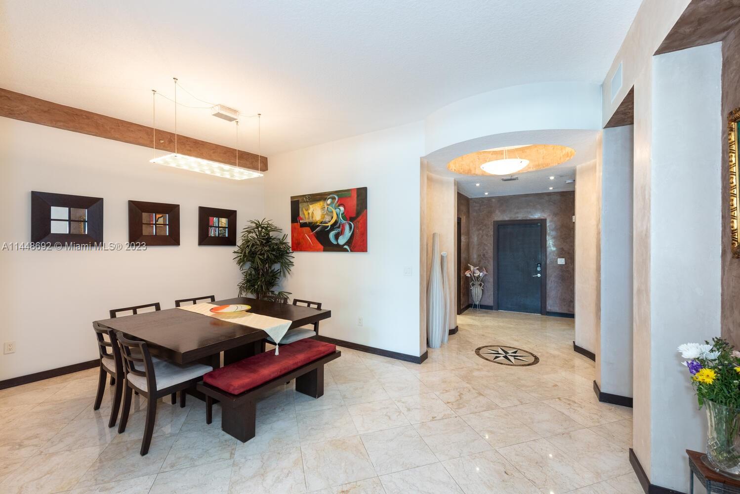 2401 Anderson Road, Unit 3 Coral Gables, FL 33134 - Photo 5 of 46 a reading room with furniture and wooden floor