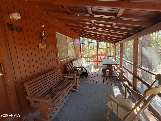 a view of a patio with table and chairs