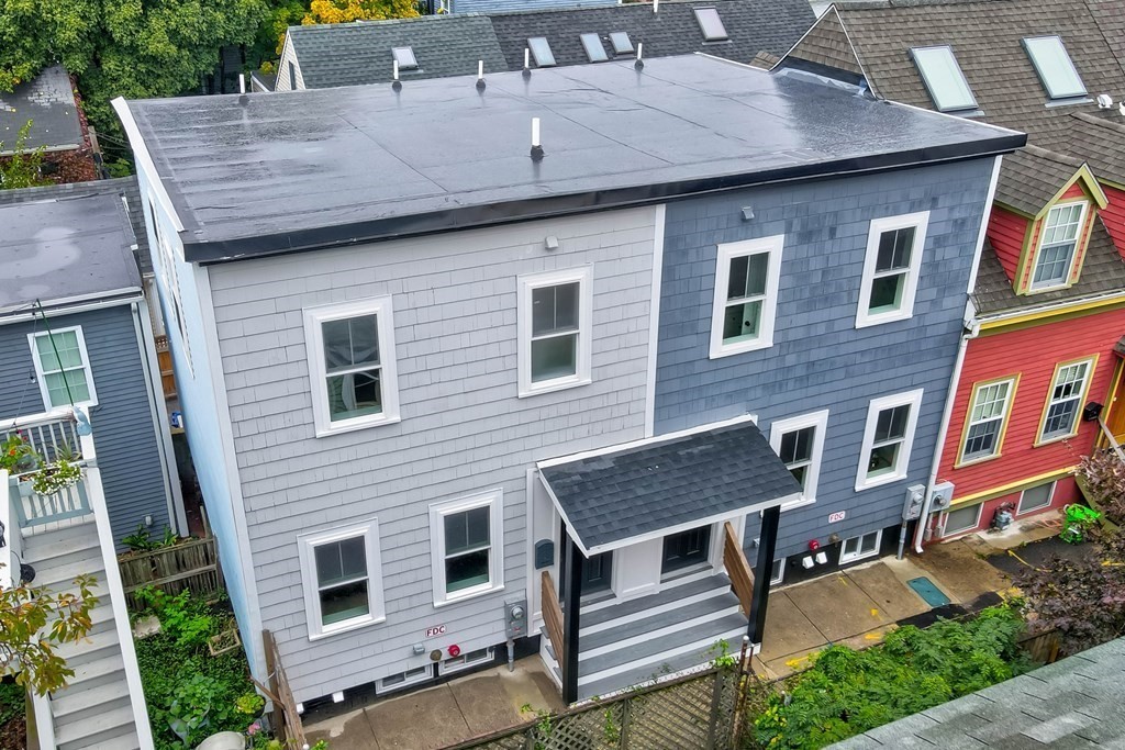 2 Coral Place Boston, MA 02129 - Photo 1 of 17 a front view of a house with a garden and balcony