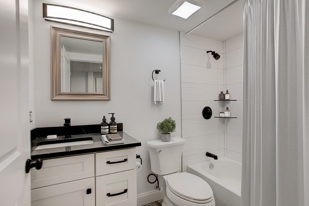 2 Coral Place Boston, MA 02129 - Photo 13 of 17 a bathroom with a sink a toilet and shower