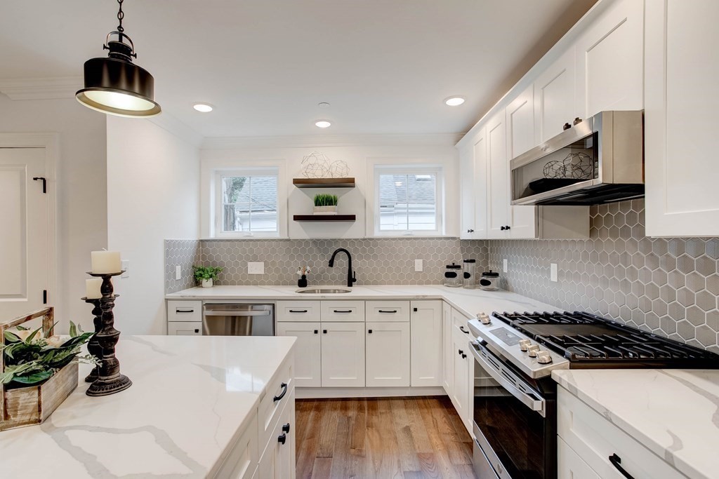 2 Coral Place Boston, MA 02129 - Photo 4 of 17 a kitchen with cabinets appliances a sink and a counter top space
