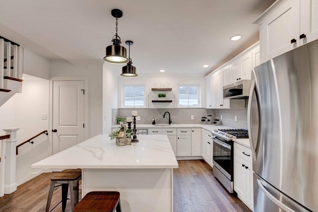 2 Coral Place Boston, MA 02129 - Photo 5 of 17 a kitchen with stainless steel appliances a sink a stove a refrigerator cabinets and wooden floor