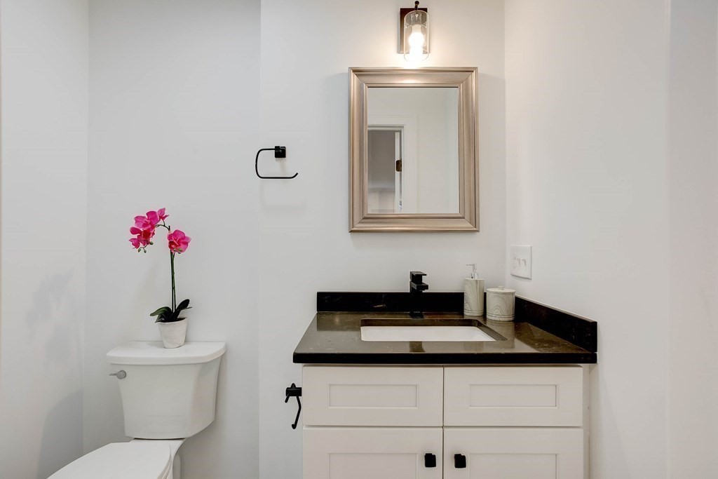 2 Coral Place Boston, MA 02129 - Photo 9 of 17 a bathroom with a sink toilet and vanity