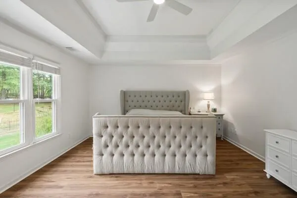 a spacious bathroom with a double vanity sink a large mirror and shower