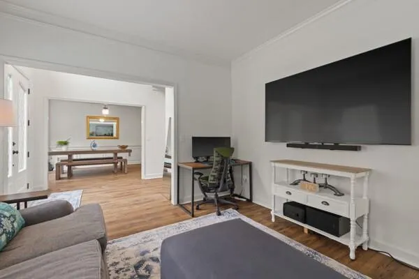 a living room with furniture and a flat screen tv