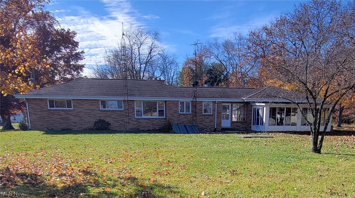 405 Bryan Road Milan, OH 44846 - Photo 23 of 35 View of back of home featuring a large lawn