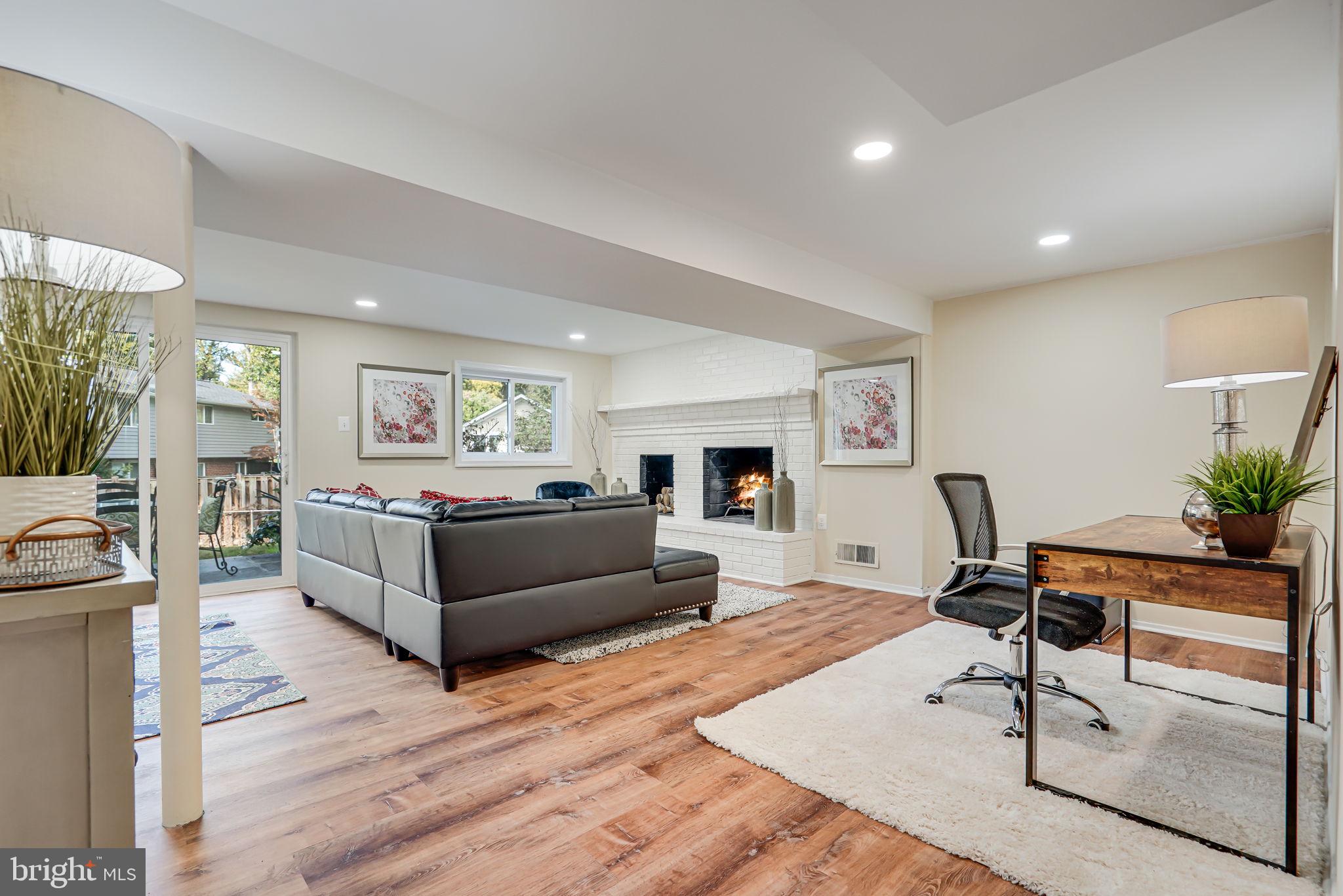 8621 Cromwell Drive Springfield, VA 22151 - Photo 15 of 24 Lower level finished room with wood burning firepl