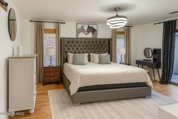 a bedroom with bed and window