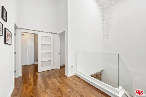 a spacious bathroom with a double vanity sink mirror and shower