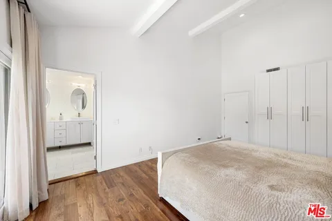 a spacious bathroom with a double vanity sink mirror and toilet