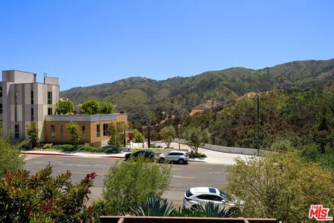 a view of room with wooden floor
