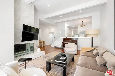 a dining room with furniture and garden view