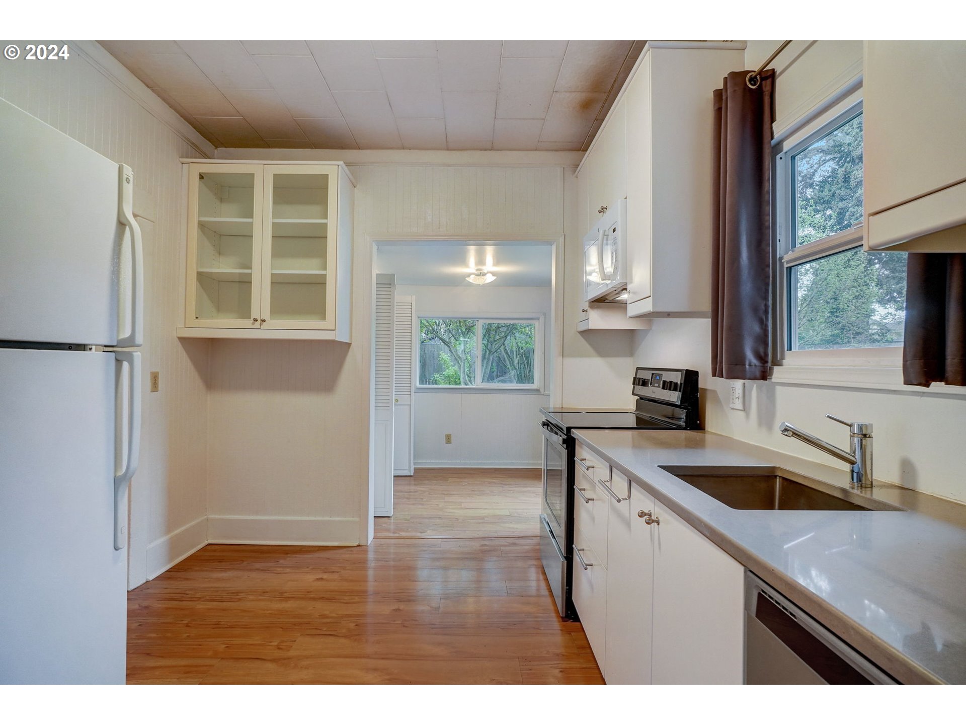1248 North Watts Street Portland, OR 97217 - Photo 13 of 36 a kitchen with a sink cabinets and window