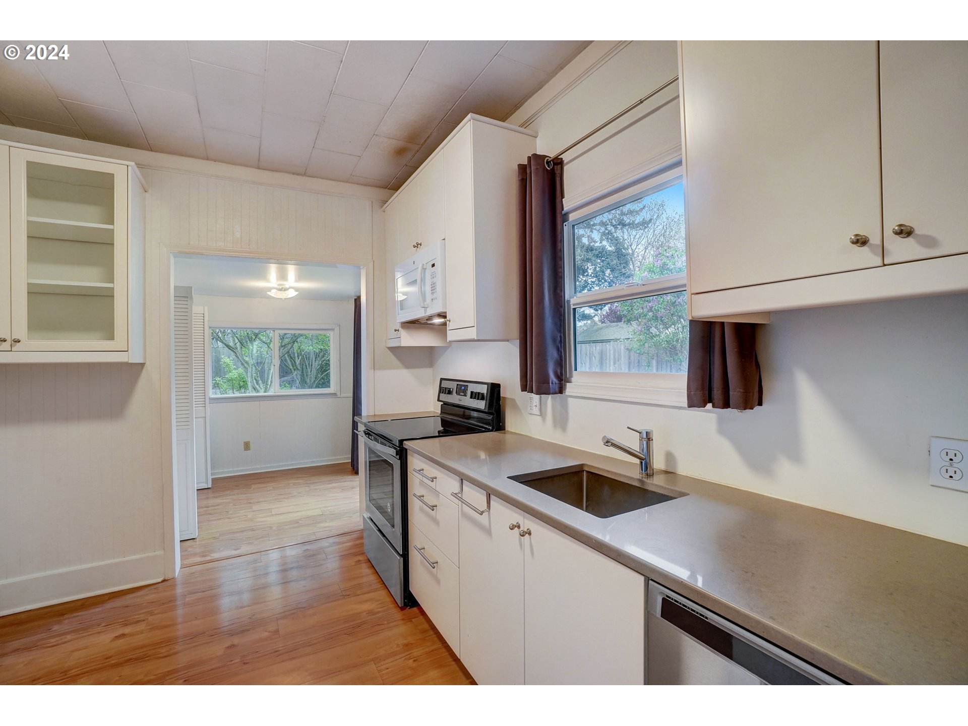 1248 North Watts Street Portland, OR 97217 - Photo 14 of 36 a kitchen that has a sink and a stove