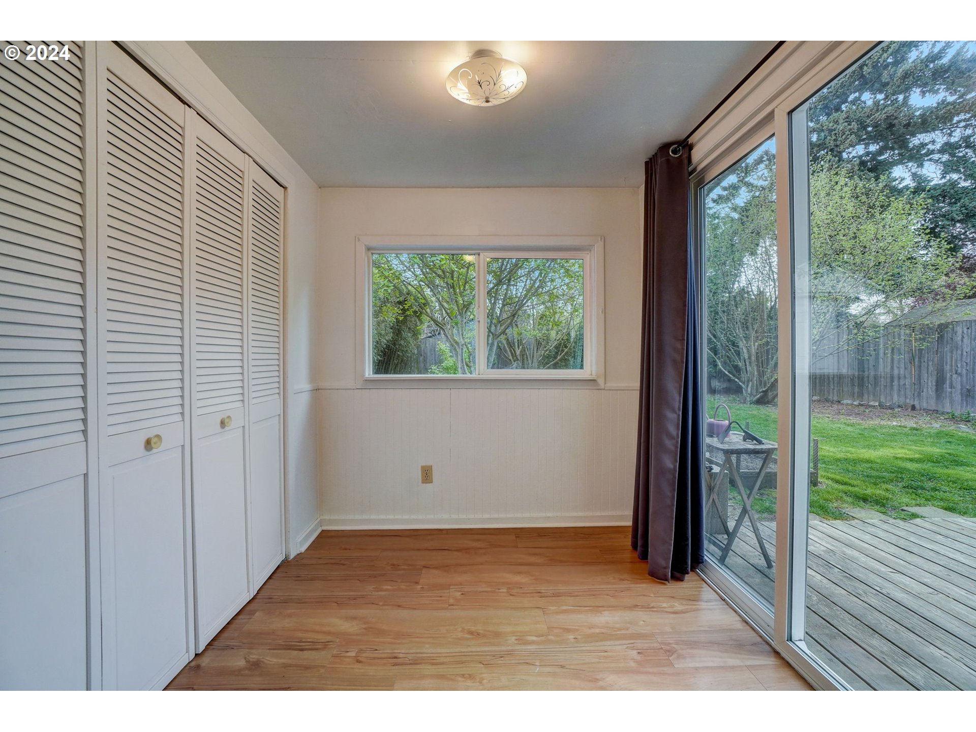 1248 North Watts Street Portland, OR 97217 - Photo 19 of 36 a view of an empty room with wooden floor and a window
