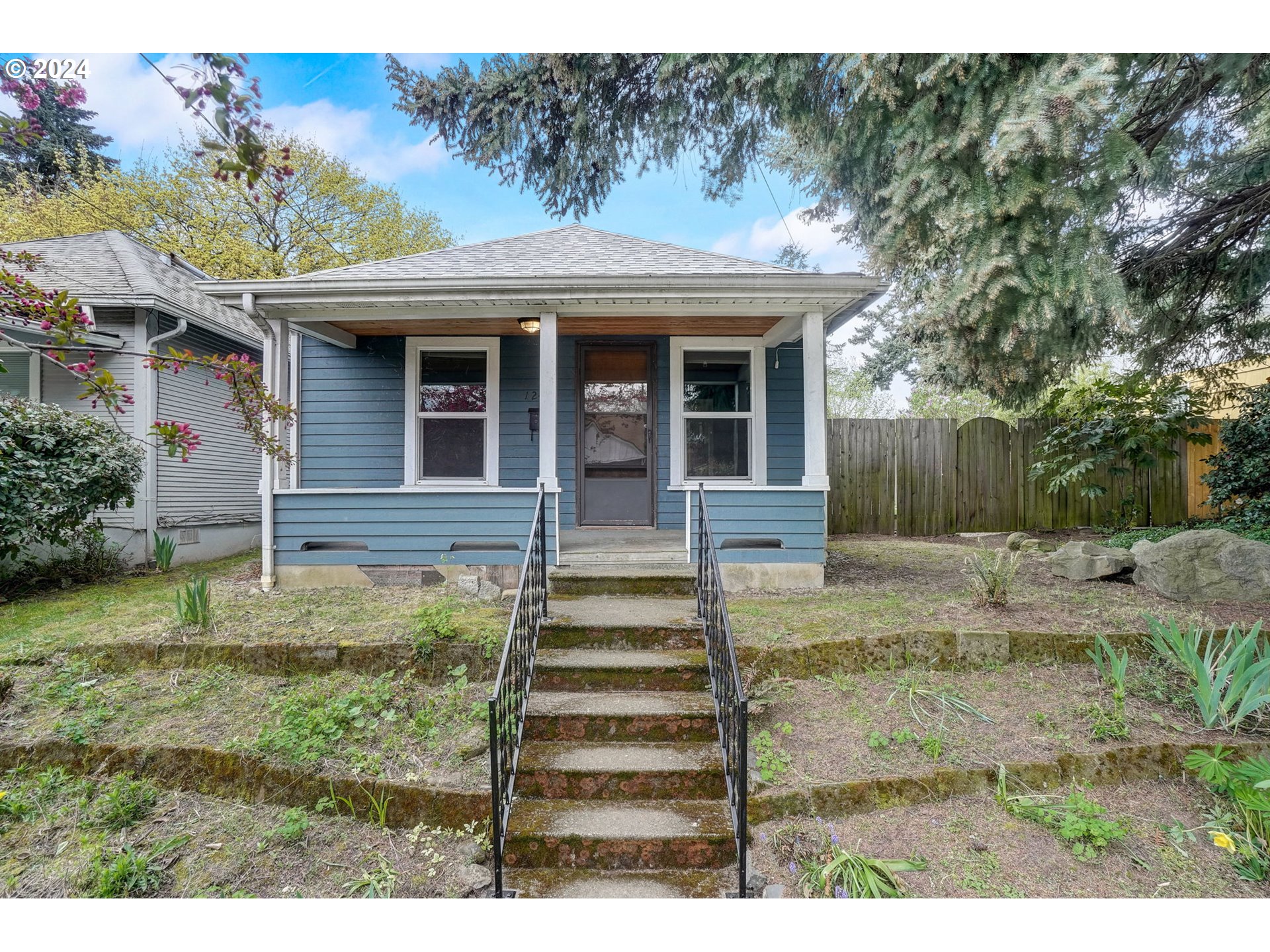 1248 North Watts Street Portland, OR 97217 - Photo 2 of 36 a front view of a house with a yard