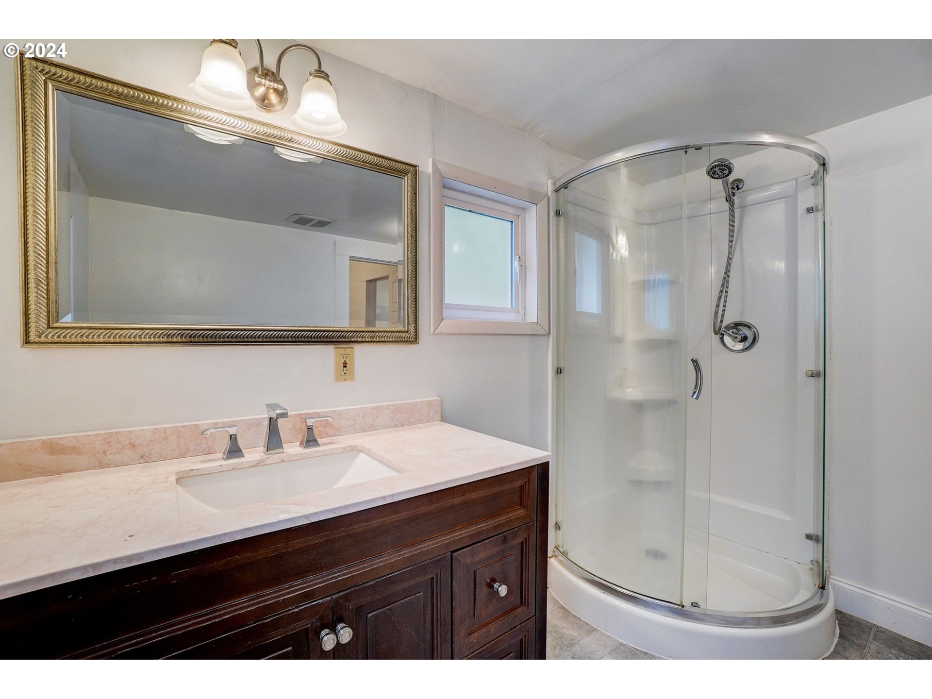 1248 North Watts Street Portland, OR 97217 - Photo 28 of 36 a bathroom with a sink and a mirror