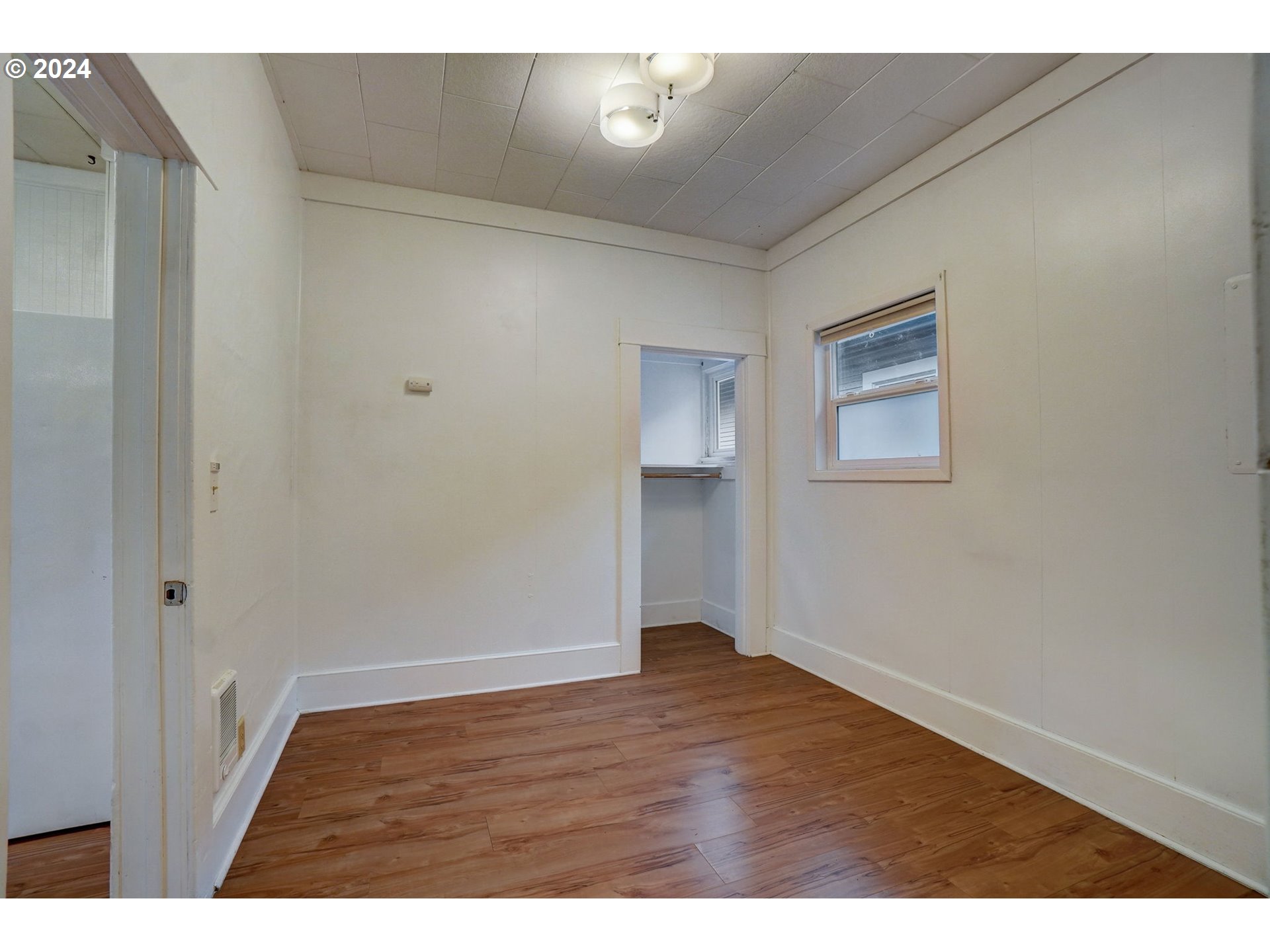 1248 North Watts Street Portland, OR 97217 - Photo 29 of 36 a view of an empty room with wooden floor