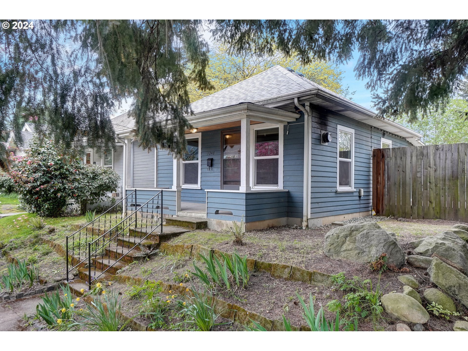 1248 North Watts Street Portland, OR 97217 - Photo 4 of 36 a view of house with backyard and seating area