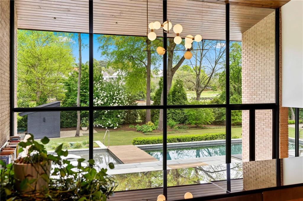 1671 Friar Tuck Road Northeast Atlanta, GA 30309 - Photo 13 of 63 a view of a porch with a potted plant