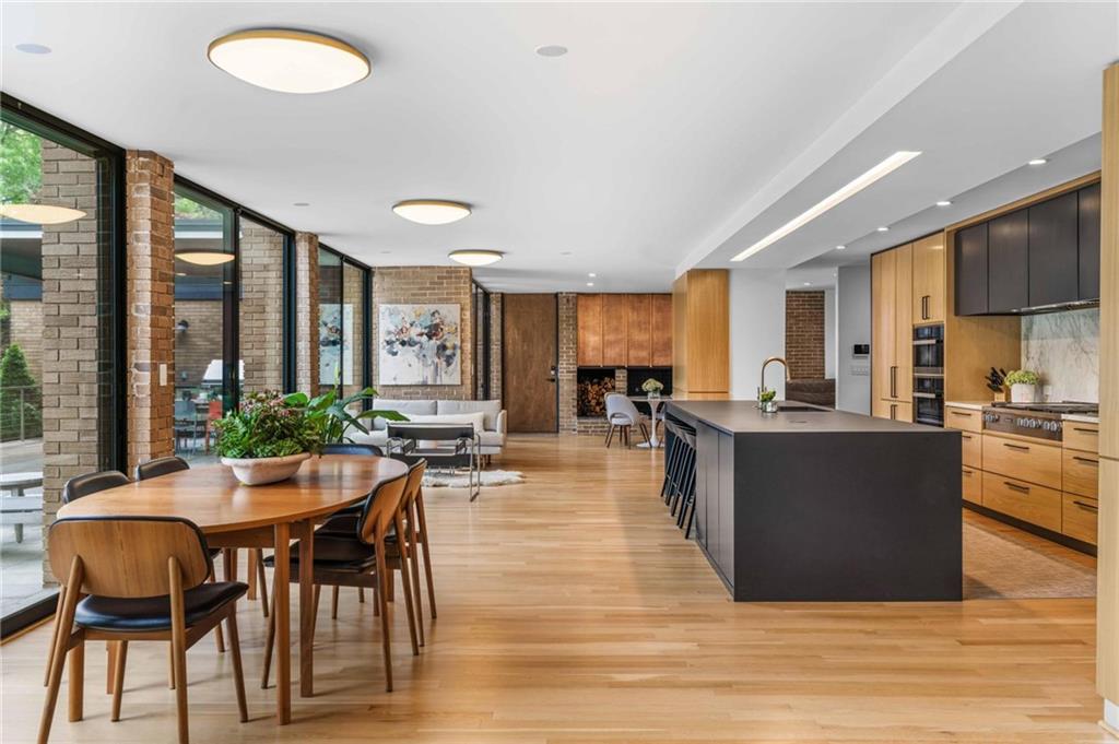 1671 Friar Tuck Road Northeast Atlanta, GA 30309 - Photo 14 of 63 a view of a dining room with furniture window and wooden floor