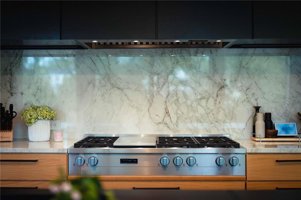 1671 Friar Tuck Road Northeast Atlanta, GA 30309 - Photo 16 of 63 a stove top oven sitting inside of a kitchen