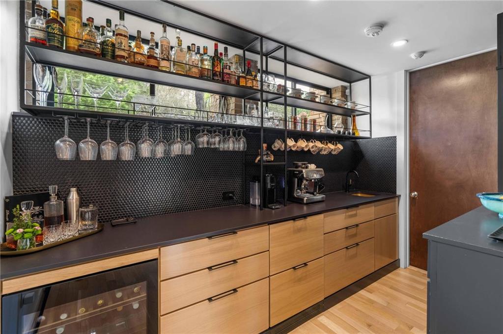 1671 Friar Tuck Road Northeast Atlanta, GA 30309 - Photo 25 of 63 a kitchen with refrigerator and cabinets
