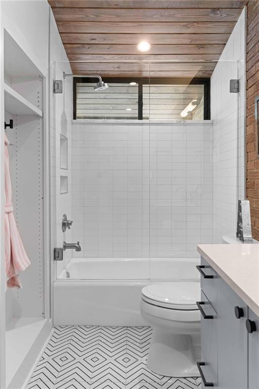 1671 Friar Tuck Road Northeast Atlanta, GA 30309 - Photo 34 of 63 a bathroom with a toilet a sink and bathtub