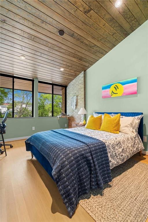 1671 Friar Tuck Road Northeast Atlanta, GA 30309 - Photo 39 of 63 a bed sitting in a bedroom next to a window