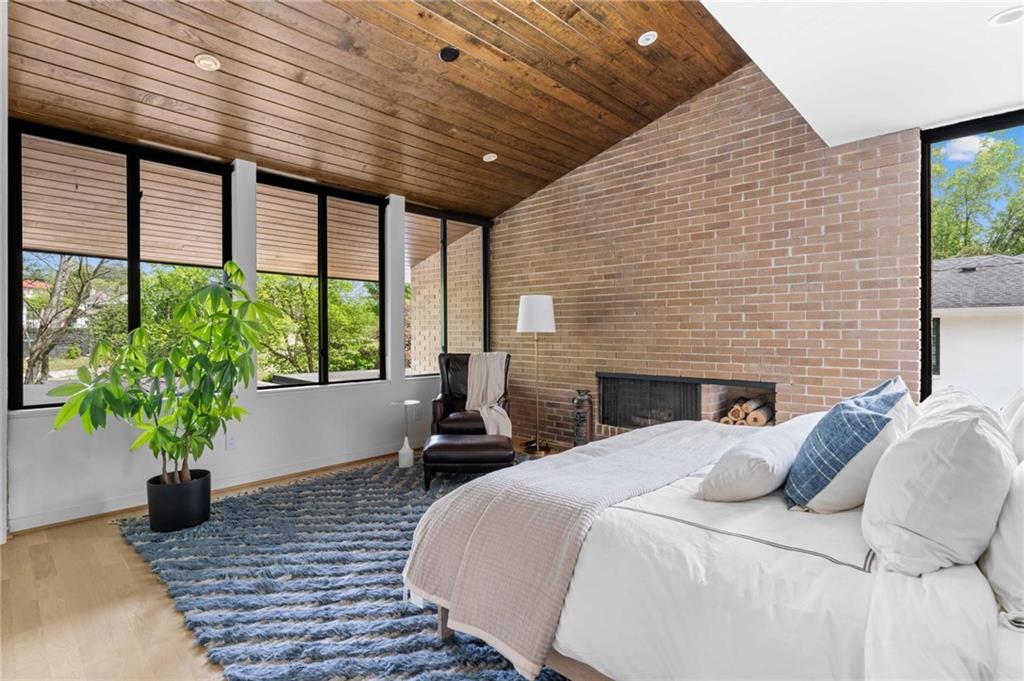 1671 Friar Tuck Road Northeast Atlanta, GA 30309 - Photo 42 of 63 a bedroom with furniture and a potted plant