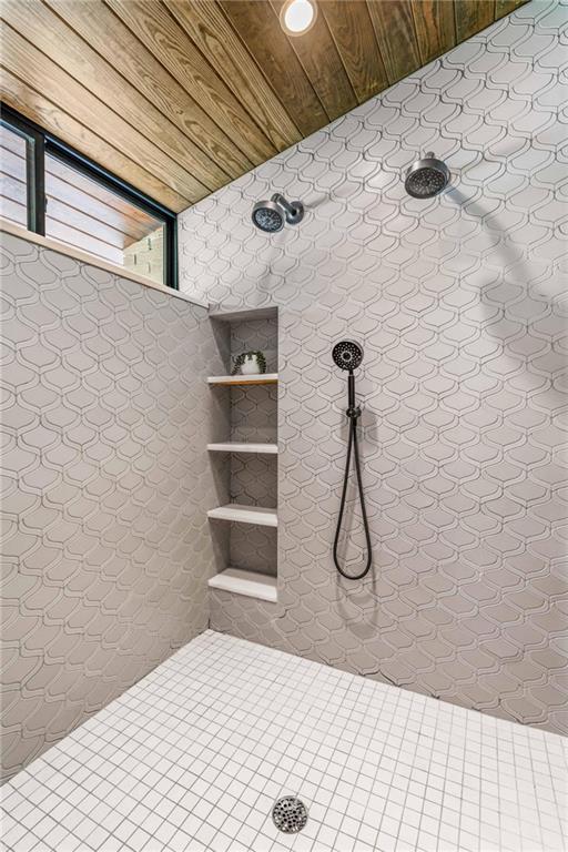 1671 Friar Tuck Road Northeast Atlanta, GA 30309 - Photo 46 of 63 a bathroom with a shower