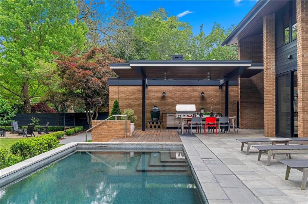 1671 Friar Tuck Road Northeast Atlanta, GA 30309 - Photo 54 of 63 a view of back yard with patio
