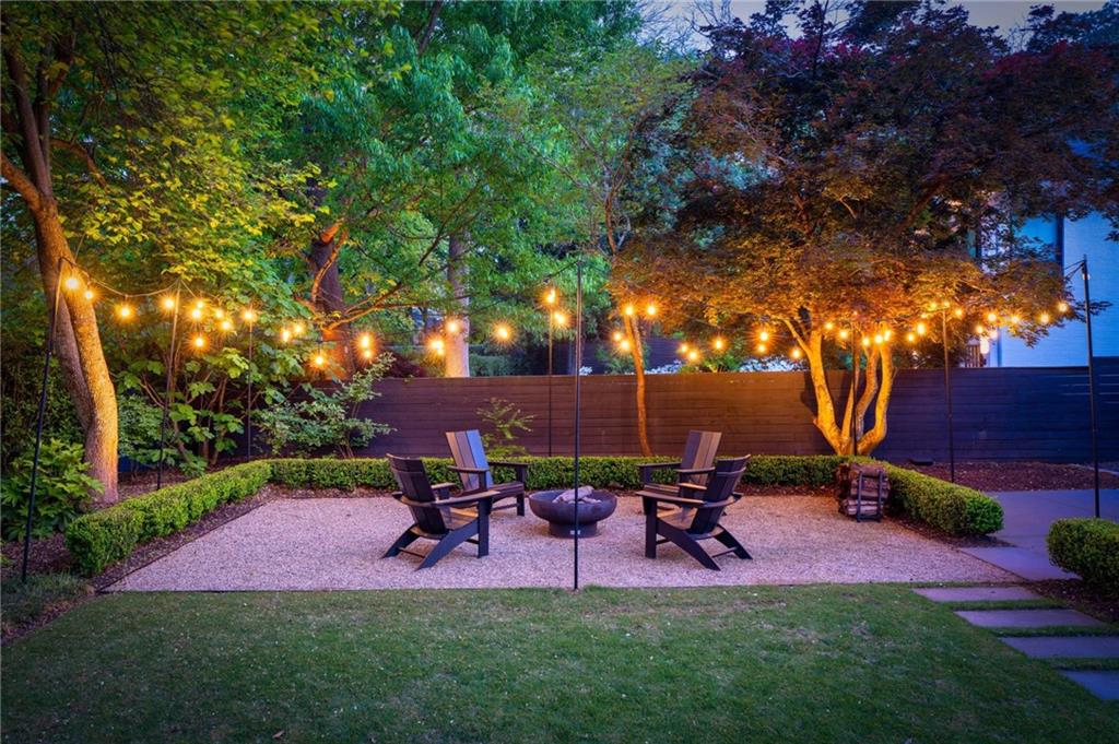1671 Friar Tuck Road Northeast Atlanta, GA 30309 - Photo 55 of 63 a view of a chairs and table in backyard