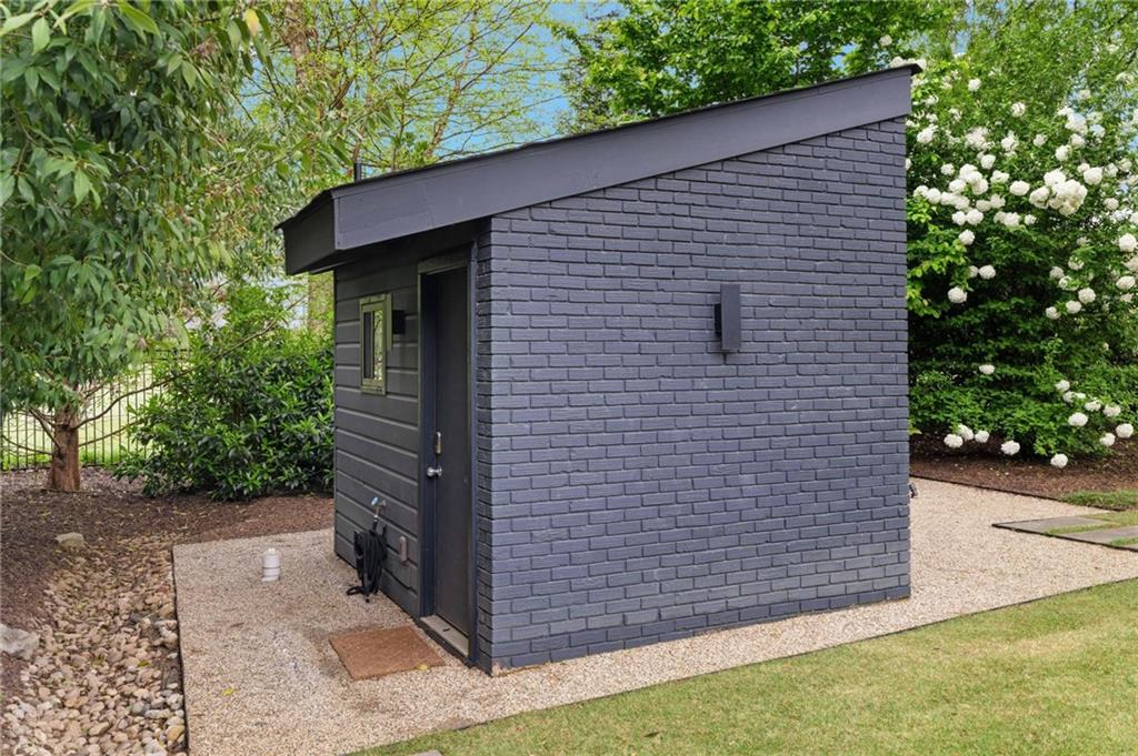 1671 Friar Tuck Road Northeast Atlanta, GA 30309 - Photo 60 of 63 a backyard of a house with lots of green space