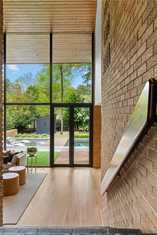 1671 Friar Tuck Road Northeast Atlanta, GA 30309 - Photo 6 of 63 a view of a porch with wooden floor and iron stairs