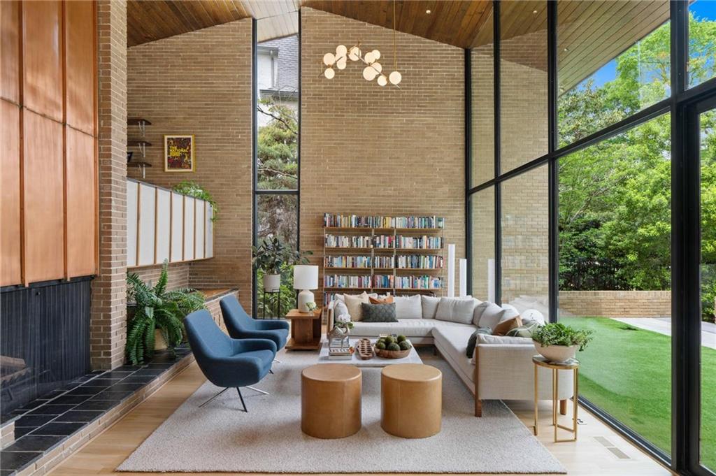 1671 Friar Tuck Road Northeast Atlanta, GA 30309 - Photo 9 of 63 a view of a balcony with chairs and a potted plant