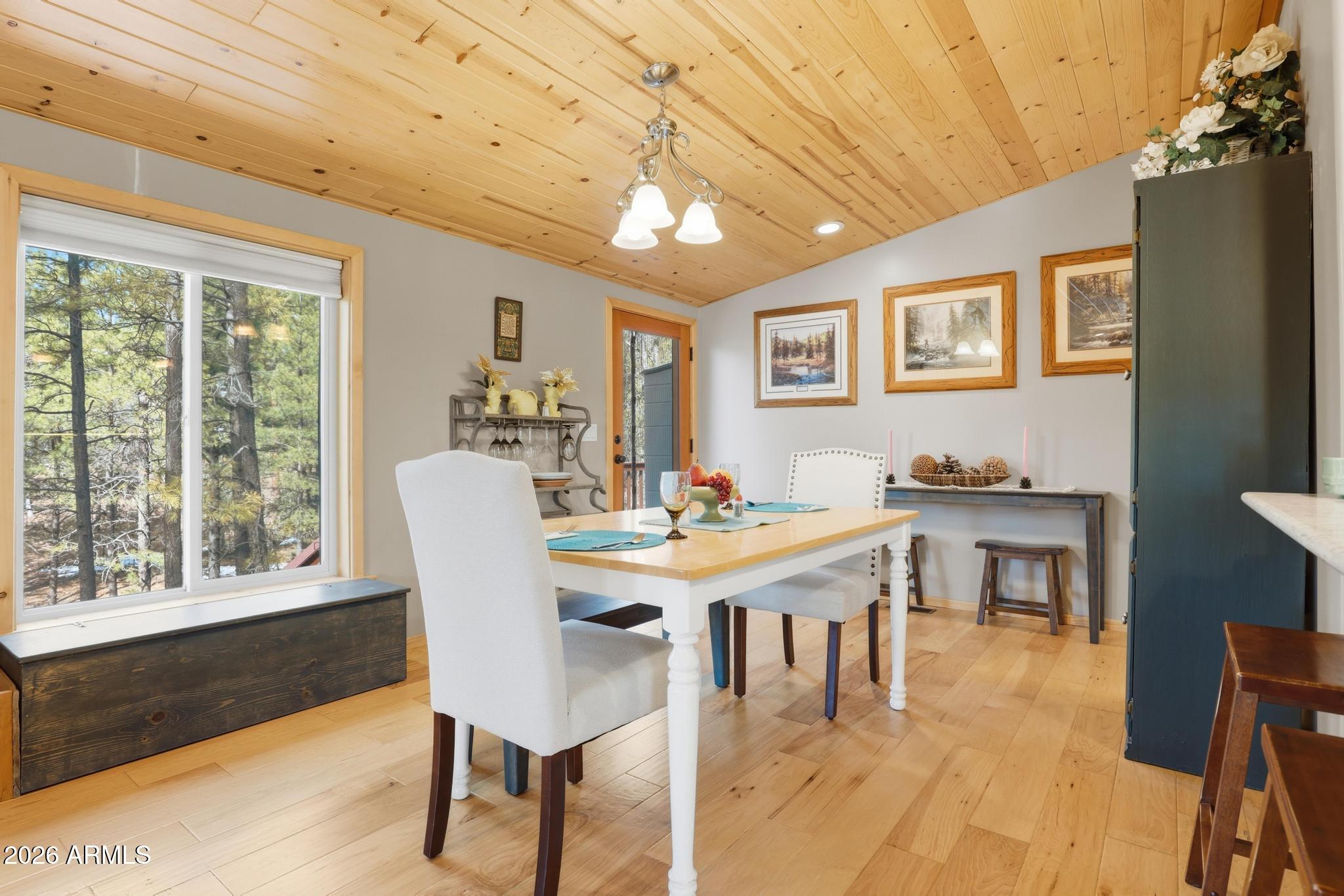 396 Leisure Lane Payson, AZ 85541 - Photo 11 of 61 a view of a dining room with furniture window and wooden floor