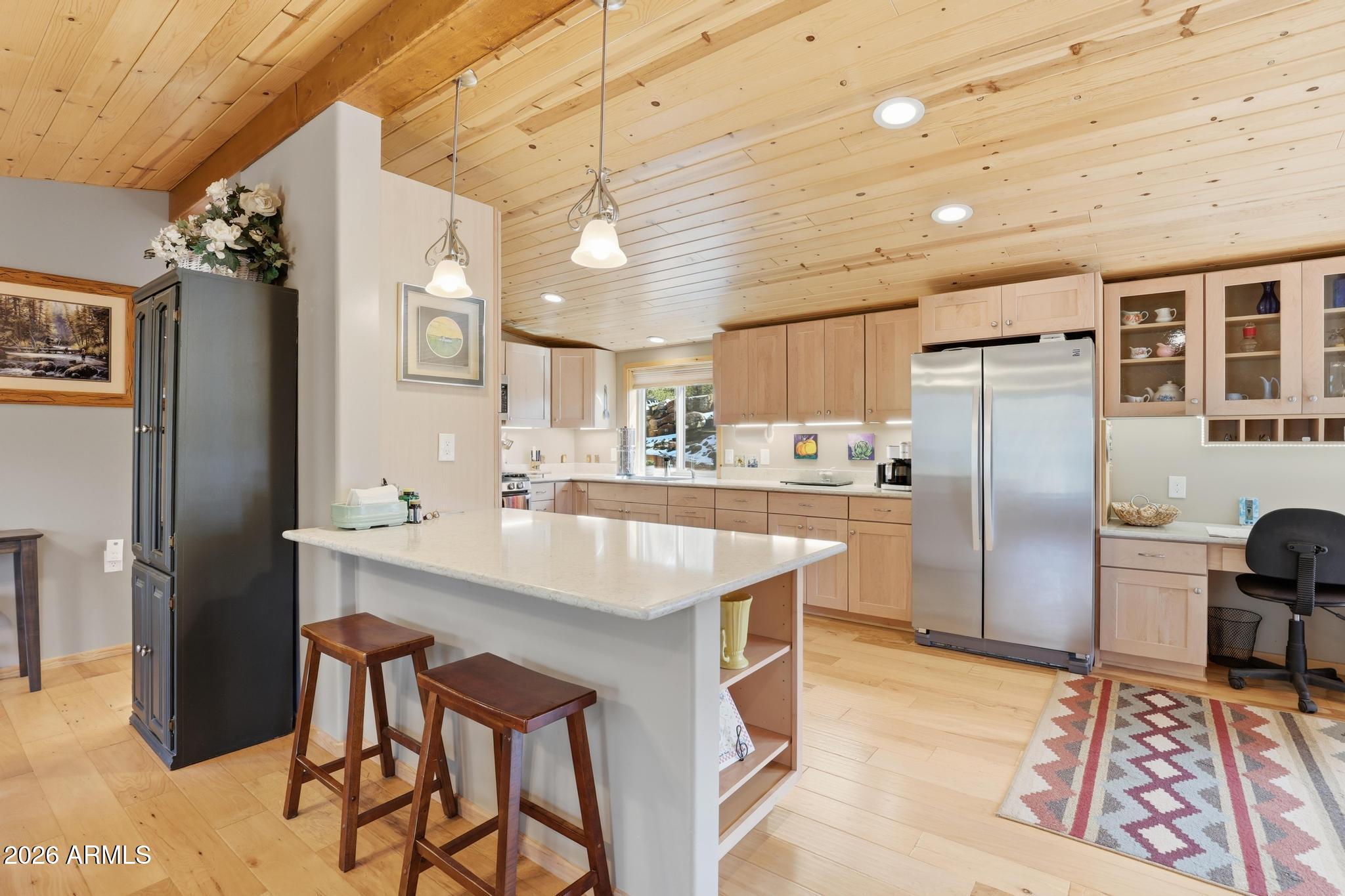 396 Leisure Lane Payson, AZ 85541 - Photo 12 of 61 a kitchen with stainless steel appliances granite countertop a sink a stove a refrigerator cabinets and chairs