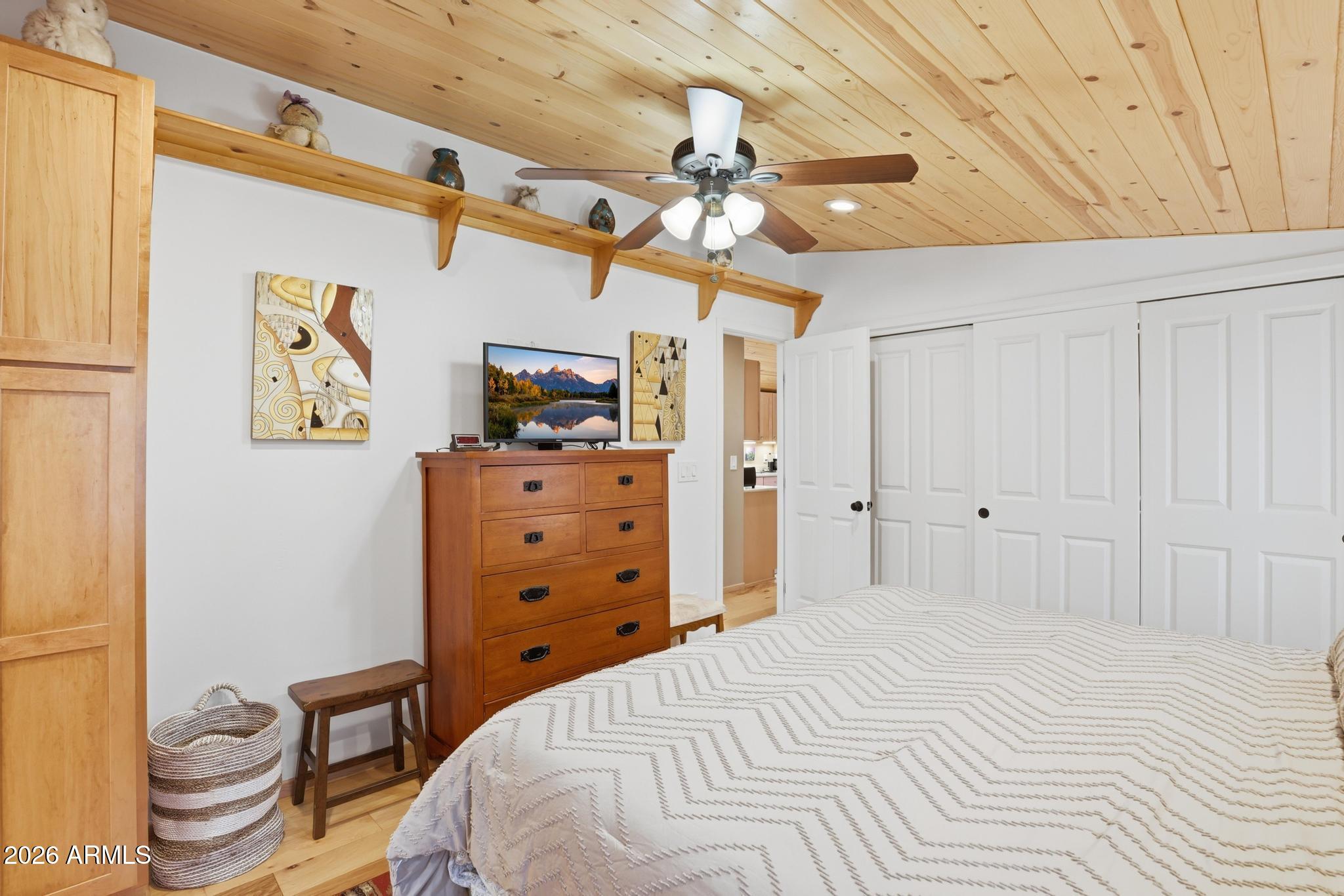 396 Leisure Lane Payson, AZ 85541 - Photo 18 of 61 a bedroom with a bed and a chandelier