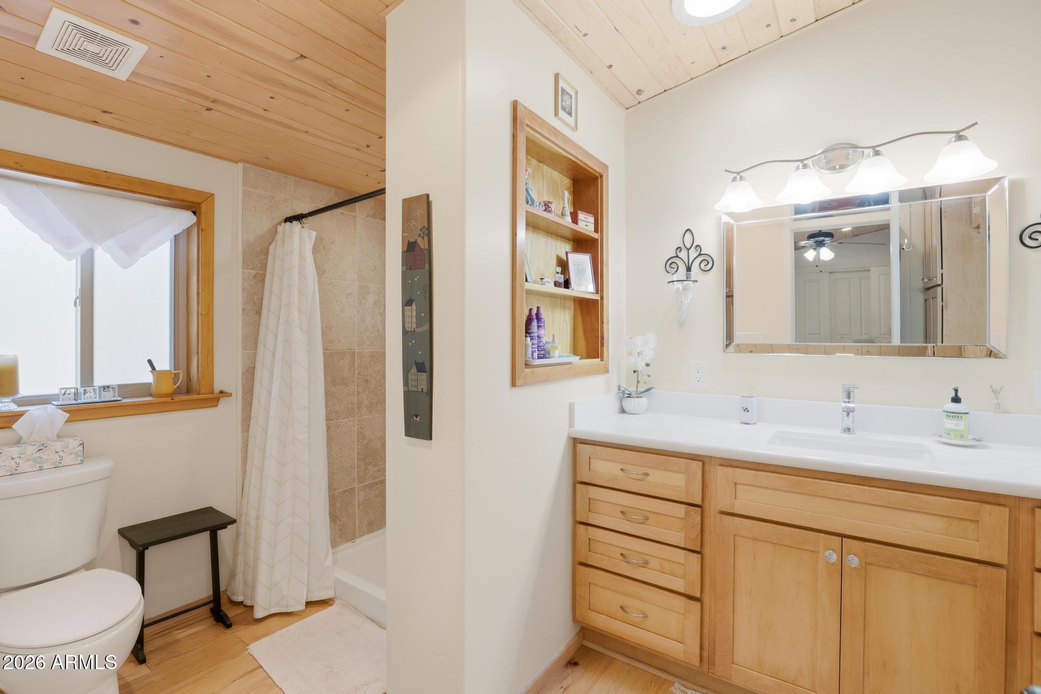 396 Leisure Lane Payson, AZ 85541 - Photo 19 of 61 a bathroom with a double vanity sink mirror and toilet