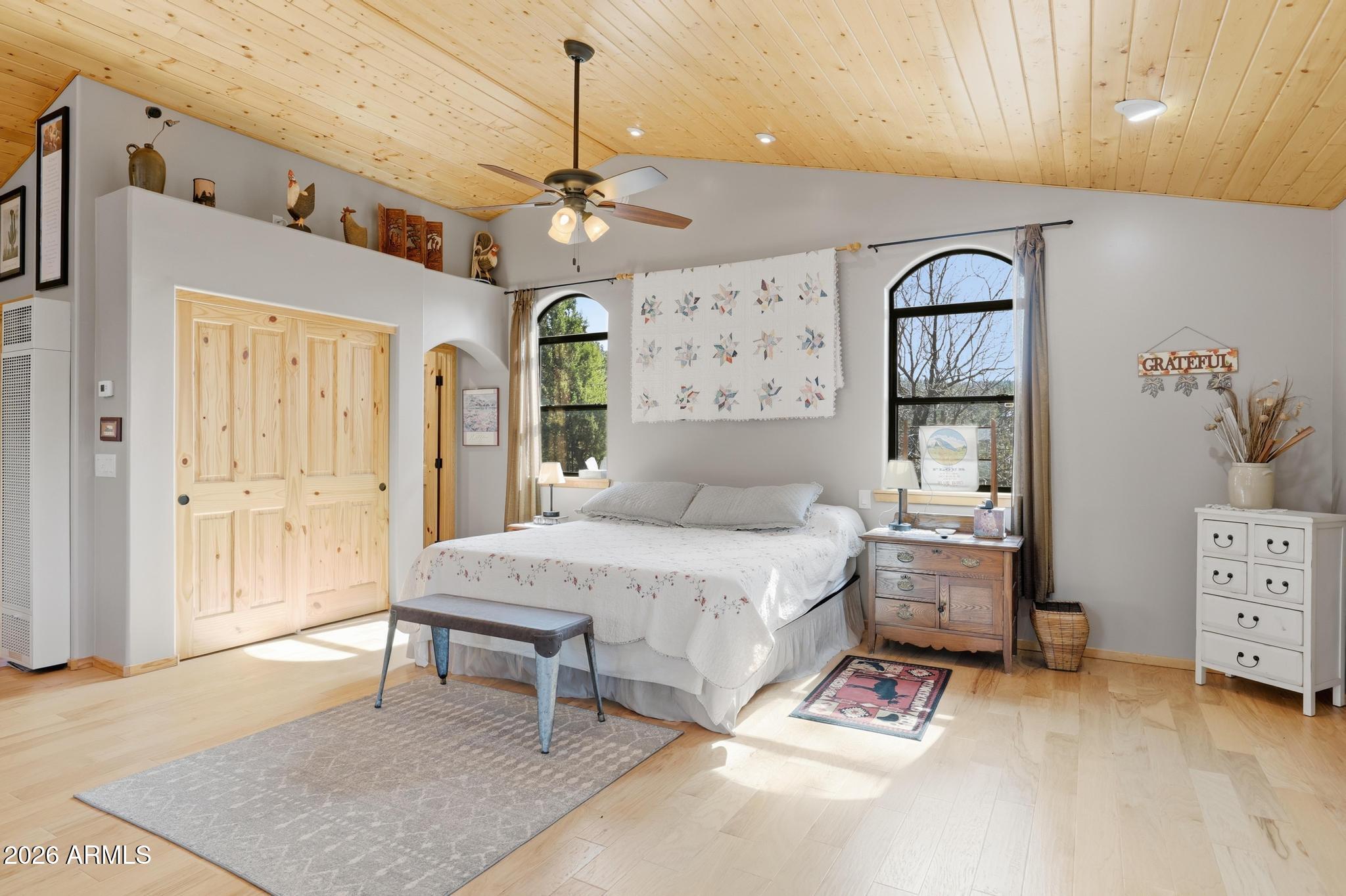 396 Leisure Lane Payson, AZ 85541 - Photo 32 of 61 a spacious bedroom with a bed a window and dresser