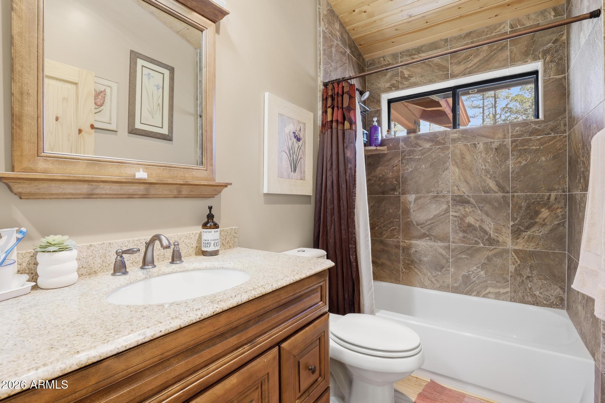 396 Leisure Lane Payson, AZ 85541 - Photo 33 of 61 a bathroom with a granite countertop sink toilet and shower