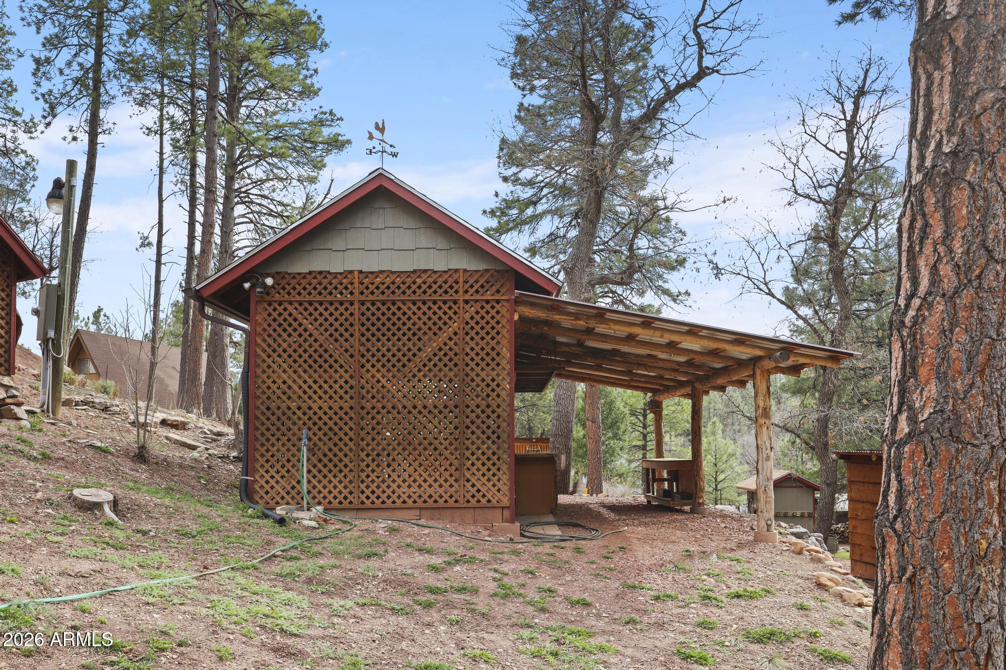 396 Leisure Lane Payson, AZ 85541 - Photo 40 of 61 a view of a house with a yard chairs and wooden fence