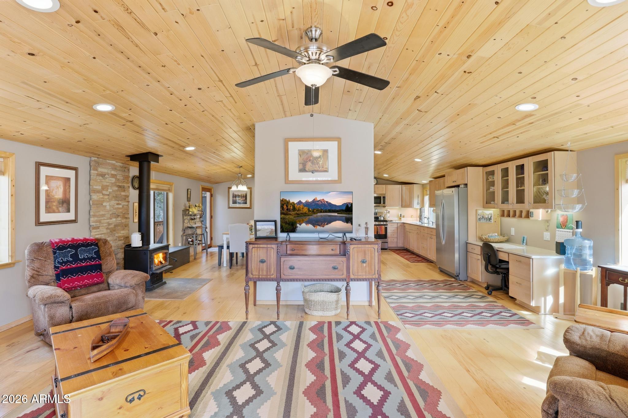 396 Leisure Lane Payson, AZ 85541 - Photo 5 of 61 a living room with furniture and a chandelier