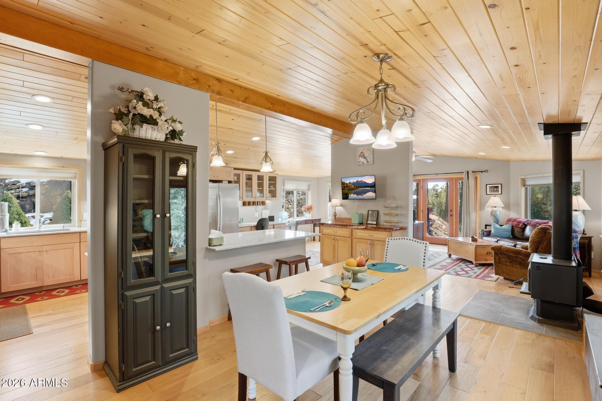 396 Leisure Lane Payson, AZ 85541 - Photo 10 of 61 a dining room with stainless steel appliances granite countertop a table and chairs
