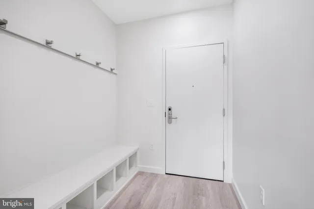 a hallway view with hardwood floor