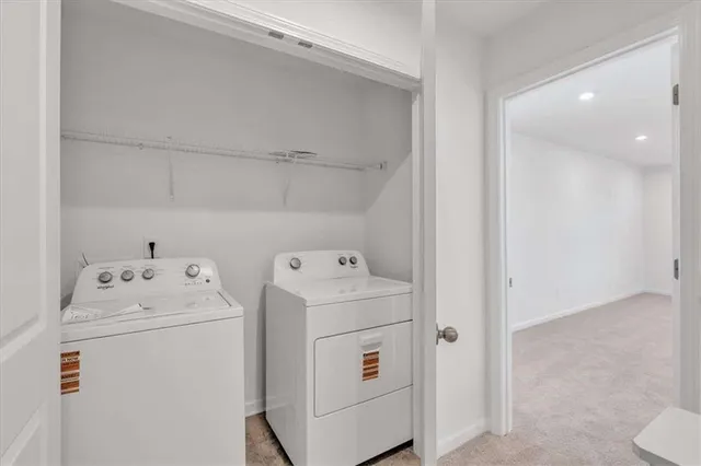 an empty room with window and mirror