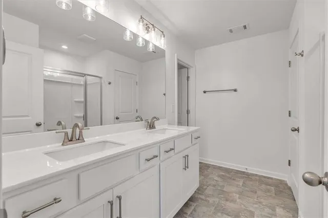 a white toilet sitting next to a white cabinet